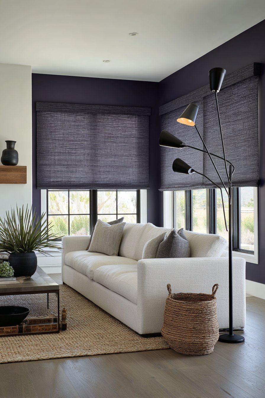 Eggplant purple accent wall with oatmeal linen sofa, oak and black metal shelving and black arc floor lamp